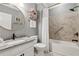 Bathroom with a white vanity, framed mirror, tub-shower combo, and decorative accents at 2470 Crimson Downs Dr, Cumming, GA 30040