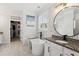 Bright bathroom featuring a soaking tub, granite countertop, and tiled walls and floors at 2470 Crimson Downs Dr, Cumming, GA 30040