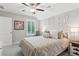 Cozy bedroom with neutral walls, a ceiling fan, and plenty of natural light at 2470 Crimson Downs Dr, Cumming, GA 30040