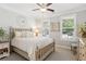 Cozy bedroom with natural light, plantation shutters, and patterned carpet at 2470 Crimson Downs Dr, Cumming, GA 30040