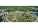Aerial view showcasing the community center, pool, tennis courts, and green spaces at 2470 Crimson Downs Dr, Cumming, GA 30040