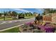 Community entrance with stone monuments, lush flowerbeds, and decorative horse statues at 2470 Crimson Downs Dr, Cumming, GA 30040