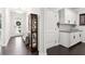 Bright foyer with hardwood floors, display cabinet and a view of the front door and entryway at 2470 Crimson Downs Dr, Cumming, GA 30040