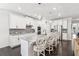 Bright kitchen with white cabinetry, stainless steel appliances, and a stylish center island with bar stool seating at 2470 Crimson Downs Dr, Cumming, GA 30040