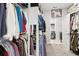 Well-organized walk-in closet with shelving and hanging space plus a laundry room at 2470 Crimson Downs Dr, Cumming, GA 30040