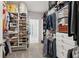 Spacious walk-in closet with ample shelving, hanging space, and good lighting at 2470 Crimson Downs Dr, Cumming, GA 30040