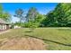 The home is surrounded by greenery and provides plenty of open space and privacy at 3049 Highway 411 Ne, White, GA 30184