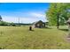 The large, beautiful backyard is surrounded by greenery and provides plenty of open space and privacy at 3049 Highway 411 Ne, White, GA 30184