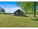 The backside of the home shows its large yard and provides plenty of open space and privacy at 3049 Highway 411 Ne, White, GA 30184