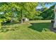 Expansive backyard featuring a shed and lush green grass, perfect for outdoor activities and relaxation at 3049 Highway 411 Ne, White, GA 30184