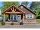 Charming one-story home with wood siding, covered porch, brick foundation, and beautifully landscaped yard at 3049 Highway 411 Ne, White, GA 30184