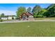 Charming one-story home with wood siding, covered porch, brick foundation, and grassy front yard at 3049 Highway 411 Ne, White, GA 30184