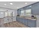 Well appointed kitchen that opens up to the living area and offers a cozy breakfast bar at 3049 Highway 411 Ne, White, GA 30184