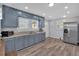 Well-lit kitchen featuring stainless steel refrigerator and matching appliances at 3049 Highway 411 Ne, White, GA 30184
