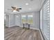 Bright living room with wood-look floors, recessed lighting, and plenty of natural light at 3049 Highway 411 Ne, White, GA 30184