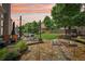 Expansive backyard features patio seating, a fire pit, lush landscaping, and a well-maintained lawn, perfect for outdoor enjoyment at 4590 Hastings Dr, Cumming, GA 30041