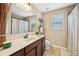Bathroom featuring a vanity, toilet and shower with curtain at 4590 Hastings Dr, Cumming, GA 30041