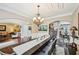 Spacious dining room with coffered ceilings, chandelier, and an open layout at 4590 Hastings Dr, Cumming, GA 30041