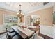 Elegant dining room with wainscoting, chandelier, and hardwood floors at 4590 Hastings Dr, Cumming, GA 30041