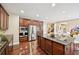 Gourmet kitchen featuring granite countertops, stainless steel appliances, and a large central island at 4590 Hastings Dr, Cumming, GA 30041