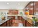 Spacious kitchen featuring granite countertops, hardwood floors, and stainless steel appliances at 4590 Hastings Dr, Cumming, GA 30041