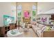 Spacious living room features a fireplace, large windows, and a comfortable sectional sofa at 4590 Hastings Dr, Cumming, GA 30041