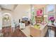 Bright living room featuring a fireplace, hardwood floors, large windows, and comfortable seating area at 4590 Hastings Dr, Cumming, GA 30041