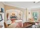 Open concept living area with hardwood floors, ample seating, and views to dining at 4590 Hastings Dr, Cumming, GA 30041