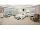 Spacious main bedroom with multiple windows, sitting area, and tray ceiling at 4590 Hastings Dr, Cumming, GA 30041