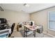 Office space featuring neutral walls, drop lighting and a large window at 4590 Hastings Dr, Cumming, GA 30041