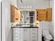 Bright bathroom features unique custom cabinets and large mirror over modern vanity at 878 Peachtree Ne St # 431, Atlanta, GA 30309
