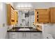Updated bathroom features custom cabinets and a large mirror with unique lighting at 878 Peachtree Ne St # 431, Atlanta, GA 30309