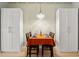 Dining room with chandelier lighting and two large white cabinets at 878 Peachtree Ne St # 431, Atlanta, GA 30309