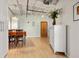 Bright dining room with hardwood floors, modern lighting, and ample space at 878 Peachtree Ne St # 431, Atlanta, GA 30309