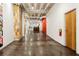 Long hallway featuring polished concrete floors and clean white walls, leading to a reception area at 878 Peachtree Ne St # 431, Atlanta, GA 30309