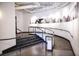 Hallway features a curved banister and a black-and-white cityscape print above the staircase to the next level at 878 Peachtree Ne St # 431, Atlanta, GA 30309
