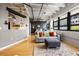 Bright living room with industrial ceilings, an open layout, and views of the city at 878 Peachtree Ne St # 431, Atlanta, GA 30309
