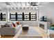 Bright and spacious living room with large windows and modern fireplace at 878 Peachtree Ne St # 431, Atlanta, GA 30309