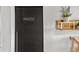 Close up of a pantry door with chalkboard paint and a small shelf at 878 Peachtree Ne St # 431, Atlanta, GA 30309