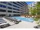 Inviting outdoor pool surrounded by lounge chairs for relaxing by the water at 878 Peachtree Ne St # 431, Atlanta, GA 30309
