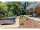 Backyard features a relaxing hot tub and covered patio, perfect for outdoor entertaining and leisure at 210 Wentworth Ter, Alpharetta, GA 30022