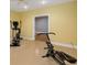 A basement with exercise equipment and carpet flooring at 210 Wentworth Ter, Alpharetta, GA 30022