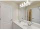 Bathroom featuring a double sink vanity with lots of storage and a large mirror at 210 Wentworth Ter, Alpharetta, GA 30022