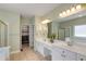 Bright bathroom with a double sink vanity with lots of storage and a large mirror at 210 Wentworth Ter, Alpharetta, GA 30022
