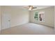 Empty bedroom with neutral walls and carpet, and a window with a view of the backyard at 210 Wentworth Ter, Alpharetta, GA 30022