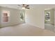 Empty bedroom with neutral walls and carpet, and three windows at 210 Wentworth Ter, Alpharetta, GA 30022