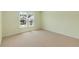 Neutral bedroom with a window for natural light and carpet flooring at 210 Wentworth Ter, Alpharetta, GA 30022