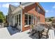 The outdoor deck offers a great space for enjoying meals with views of the lush surroundings at 210 Wentworth Ter, Alpharetta, GA 30022