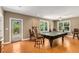 Game room featuring a pool table with a dark green felt top and plenty of natural light at 210 Wentworth Ter, Alpharetta, GA 30022