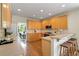 Charming kitchen with breakfast bar, wood floors, stainless appliances, and plenty of cabinets at 210 Wentworth Ter, Alpharetta, GA 30022